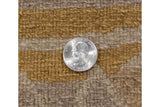 Textured hand-knotted pile on an Indian abstract carpet, showing gold and beige colors and even height.