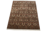 Shallow carved Indian Damask floral pattern in terracotta, ivory, and slate blue, showing fringe.