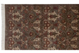 Vintage Indian Damask rug's fringe and shallow carved pattern detail.