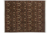Allover damask pattern on a vintage Indian carpet with shallow carved contours and varied earthy tones.