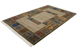 Angled view, multi-panel abstract geometric design of a hand-knotted Indian carpet with visible abrashes.