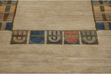 Hand-knotted pile reveals abstract geometric panels in denim blue, madder red, and bronze tones.
