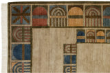 Multi-panel geometric border and ivory fringe detail on a vintage Indian abstract carpet.