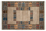 Corner detail of vintage Indian abstract carpet, multi-panel geometric design in denim blue and red.