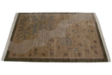 Slate blue flora and fauna with shallow carved abrashes on a pictorial rug.