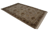 Brown floral palmettes and vinery on the beige Arts and Crafts Indian vintage carpet.