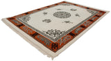 Carved tangerine border with silver floral spandrels and cloudband knots on Peking rug.