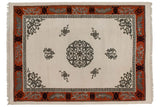 Shallow carved tangerine border with grey leaf motifs, spandrel, and fringe on the vintage Peking carpet.