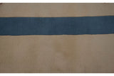 Close-up of Art Deco carpet's pale denim blue and ivory pile, showing carved contour.
