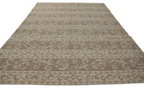 Contemporary Indian Soumac carpet pattern of alternating Rococo vines and triangles in ivory and beige.