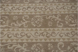 Contemporary hand woven Soumac design with ivory Rococo leaves and beige triangles.