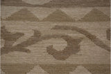 Texture and pattern of ivory and beige Soumac design showing Rococo leaves and triangles.