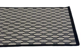 Modern Indian Soumac flatweave carpet detail: ivory, silver, charcoal basketweave and black selvage.
