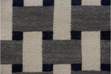 Modern Indian Soumac carpet's flat weave texture, alternating ivory, silver, and black blocks.