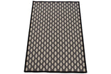 Corner detail of the Soumac design rug's ivory and charcoal basketweave with black border.