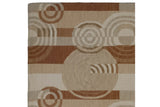 Abstract Indian Soumac rug pattern of rectilinear blocks, ripple circles, in ivory, beige, copper.