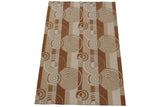 Abstract Indian Soumac pattern showing rectilinear blocks and concentric circles in ivory, beige, copper.