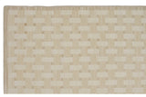 Neutral flat fiber basketweave pattern of a modern Indian Soumac rug, with striped border.