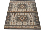Soumac rug with Southwestern wave border and serrated geometric diamond pattern.