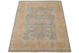 Indian Oushak carpet corner with dusty blue floral field, wheat border, and intact selvages.