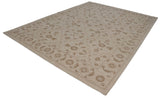 Contemporary Indian Soumac rug with an oversized ivory and pale coffee brown Rococo floral trellis.