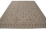 Soumac carpet detail: brown Rococo floral arabesques on an ivory field with border.