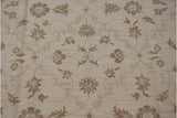 Indian Soumac rug pattern detail: ivory and beige Rococo floral arabesques with coffee tendrils.