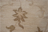 Textured Soumac weave with pale coffee brown scrolling tendrils on an ivory ground.