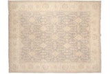 Peshawar carpet close-up: silver and ivory shield medallions and geometric leaves.