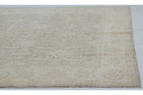 Detail of short fringe and intact selvage on the ivory-toned Peshawar carpet.