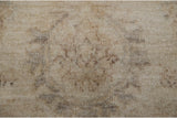 Peshawar carpet's even short pile with tone-on-tone silver, ivory, and oxidized silver hues.