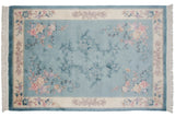 Carved sky blue Chinese Art Deco rug with tone-on-tone floral medallion.