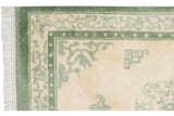 Intact fringe, moss green border, and pearl design on a Vintage Indian Peking rug.