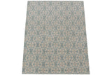 Contemporary Indian Soumac rug detail showing abrash and blue floral lattice on ivory ground.