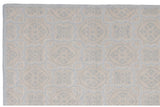 Textured pale blue and ivory roundel patterns on contemporary Indian Soumac carpet edge.