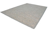 Textured roundel medallions on the Indian Soumac carpet, showing pale blue and ivory abrash.