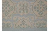 Pale blue and ivory roundel motifs with visible textured Soumac pile.