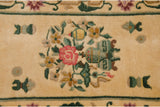 Pictorial detail of raspberry red blossom, saffron yellow vase, and dusty forest green leaves on full pile.