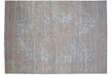 Distressed modern Indian Persian carpet showcasing faded beige and blue medallion design.