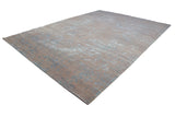 Distressed pattern on a modern Indian Persian carpet showing beige and blue abrash.
