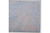Distressed blue pattern with simulated silk accents and abrash on a modern Indian Persian rug.