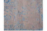Distressed powder blue pattern with simulated silk accents on the short beige pile.