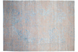 Overall distressed aesthetic with soft beige and blue abrash on a modern Indian Persian rug.