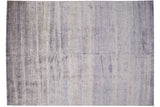 Intricate blue and ivory seeded pattern with simulated silk accents on modern Indian carpet.