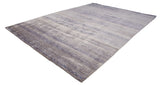Indian Modern rug corner with deep blue geometric border and patterned ivory field.
