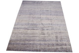 Textured blue and ivory modern rug showing horizontally repeating seeded patterns and varied sheen.