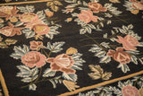 Detail of the raised chainstitch weave showing rose and copper floral bouquets on a black field.