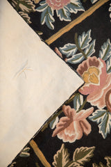 Clean cotton canvas backing and finished edge of the vintage floral chainstitch rug.