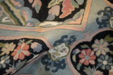 Close view of Savonnerie-inspired floral sprays in raised chainstitch embroidery.