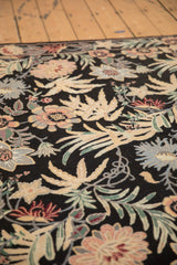 A detailed angle showing the curvilinear floral design and spiraling texture of the chainstitch weave.